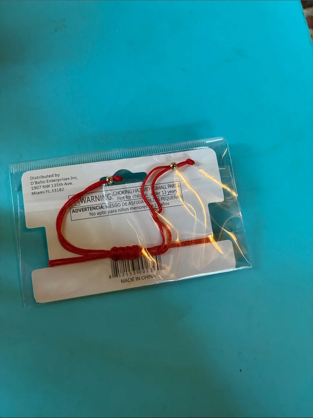 D'Bello Red Braided Bracelet with Green Four-Leaf Flower Charm